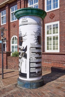 Advertising pillar with advertisement of the Stadeum at the Bahnhofstrasse in the city centre of