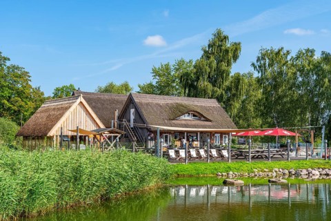 Restaurant and thatched houses in Krummin natural harbour, Krumminer Wiek on the Peenestrom, Usedom