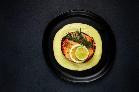 Salmon steak, fried, mashed potatoes, top view, rosemary, lemon and lime, homemade, one serving, no