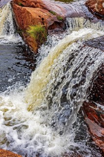 Small river and waterfall among the rocks of the Biribiri mountain range in Diamantina, Minas