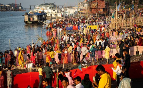 Hindu devotees crowd to perform rituals to the Sun god in the bank of Brahmaputra river on the