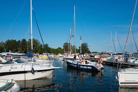 Several sailing boats in the harbour under a clear blue sky on a summer day, Gizycko,