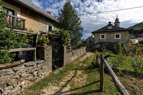 View of the village, typical Ticino stone houses in the mountain village of Rasa, Centovalli,