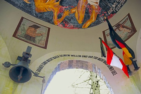 Artistic ceiling painting with flags and bell, accompanied by text, Jama pod Krenom, remembrance of