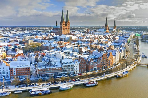Aerial view over the river Trave and church towers in the old town of the Hanseatic City of Lübeck