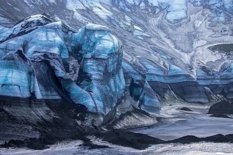 Mýrdalsjökull glacier with layers of black volcanic ash, ice cap on the top of the active Katla