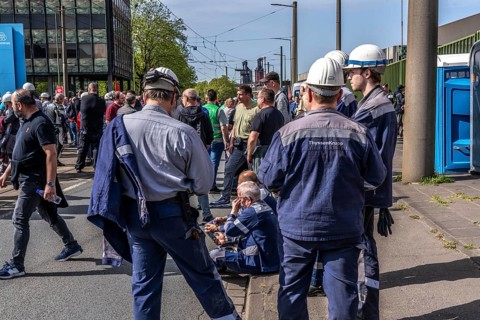 Steelworkers at a demonstration in front of the headquarters of ThyssenKrupp Steel Europe in