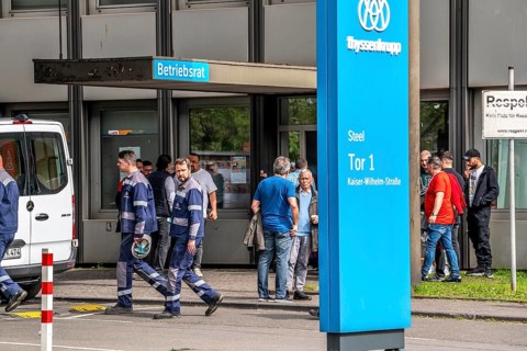 Steelworkers at a demonstration in front of the headquarters of ThyssenKrupp Steel Europe in