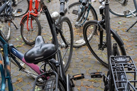Large bicycle car park in front of the main railway station in, removed saddle, theft protection,