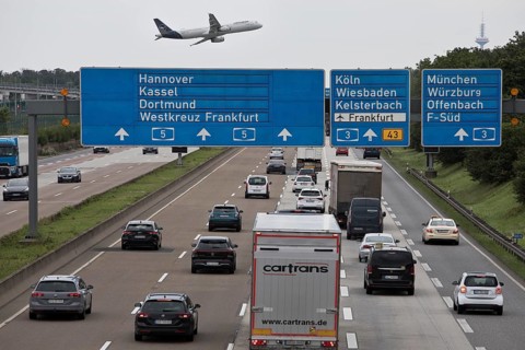 Aircraft from the airport located directly next to the motorway above the traffic on the A5