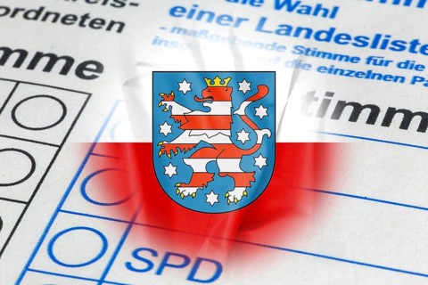 Symbolic image of the state election in Thuringia: Flag of Thuringia and close-up of a ballot paper