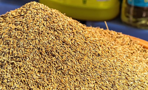 Bunch of unpolished brown rice on the food market
