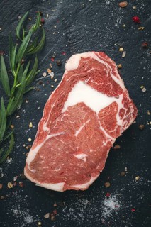 Fresh, raw rib eye steak, top view