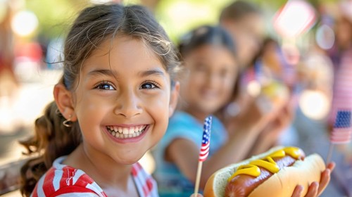 Cute girls celebrating with friends and family outdoors with hot dogs. generatvie AI, AI generated