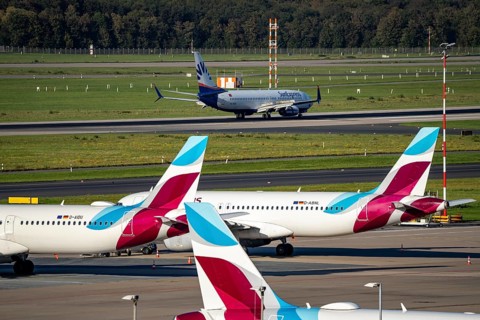 Düsseldorf Airport, Sunexpress Boeing 737 after landing, Eurowings Airbus aircraft in parking