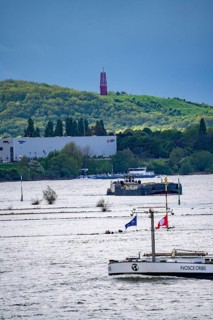 Cargo ships on the Rhine near Duisburg, in the background the Rheinpreußen spoil tip in Mörs, with