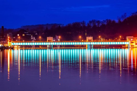 Lake Baldeney, illuminated weir, with lock, left and hydroelectric power plant power station,