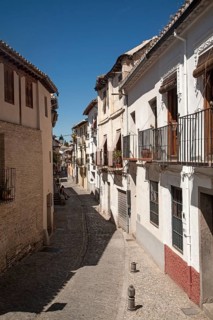 Narrow streets of Moorish houses in the Albaicin district, San Juan de Los Reyes street, Granada,