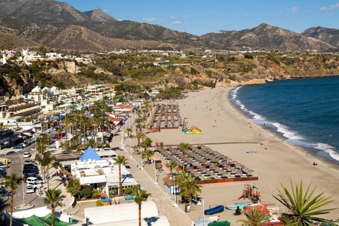 Playa Burriana sandy beach at popular holiday resort town of Nerja, Malaga province, Spain, Europe