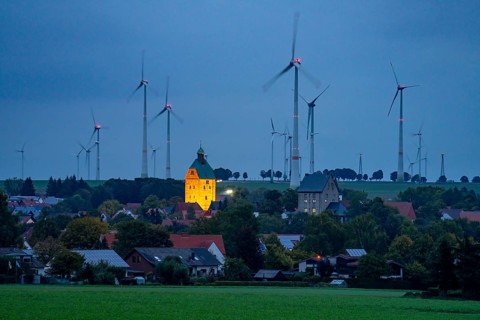 Wind farm above the village of Lichtenau, self-proclaimed energy town, houses with photovoltaic