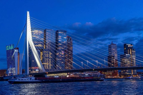 The skyline of Rotterdam, with the Erasmus Bridge over the Nieuwe Maas, skyscrapers in the Kop van