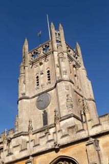 Clock tower of historic village parish church of Saint Mary, Fairford, Cotswolds Gloucestershire,
