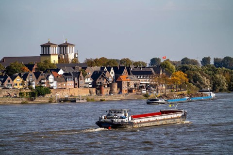 Cargo ships on the Rhine near Rees, Church of the Assumption of the Virgin Mary North