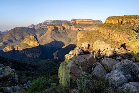 Sunset at Blyde River Canyon with Three Rondawels peak, view of canyon with Blyde River and Mesa