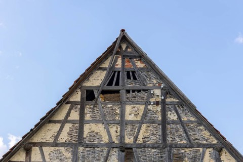 Old historic half-timbered house, gable, façade, in need of renovation, Swabian Alb,