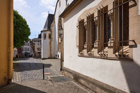 Window with forged grille for burglary protection of the church of St John the Baptist with
