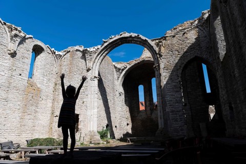 Silhouette of a girl with outstretched arms, church ruins, Hanseatic city of Visby, UNESCO World