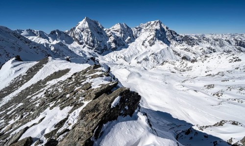 Mountain panorama with snow-covered mountain landscape in winter, view of mountain peaks