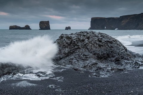 Waves, surf, black beach, lava beach, columnar basalt, rock needles, long exposure, Dyrhólafjara,