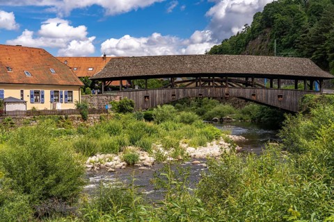The covered wooden bridge over the river Murg in Forbach, Murg Valley, Black Forest,