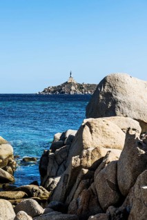 Lighthouse and rocks, Capo Carbonara, Villasimius, south coast, Sardinia, Italy, Europe
