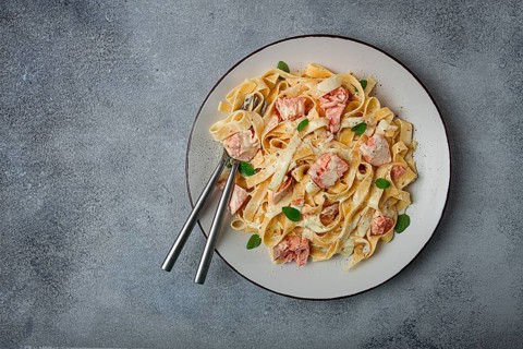 Tagliatelle pasta, in cream sauce with salmon, homemade, no people