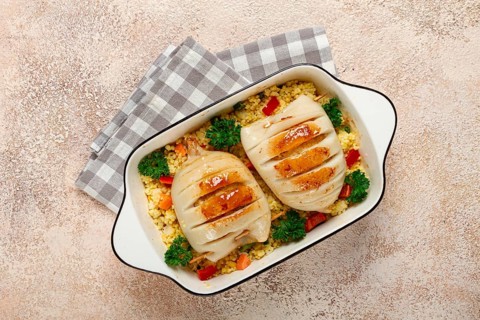 Stuffed squid carcasses, baked in the oven, fried, with couscous, top view, homemade, no people
