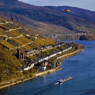 Elevated view of the Rhine and Lorch from Bacharach with barge and helicopter, Upper Middle Rhine