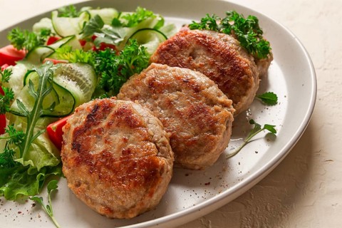 Fried cutlets, turkey, with vegetable salad, top view, no people