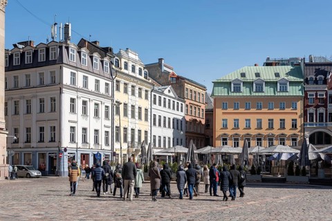 Tourists walk across the cathedral square in the Latvian capital Riga, Latvia, Europe