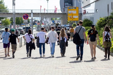 Adenau, Germany, 8 June 2024: Fans on their way from one of the Rock am Ring campsites to the