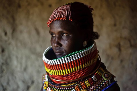 Portrait of a woman from the Turkana tribe, Kenya. She is adorned with traditional beadwork