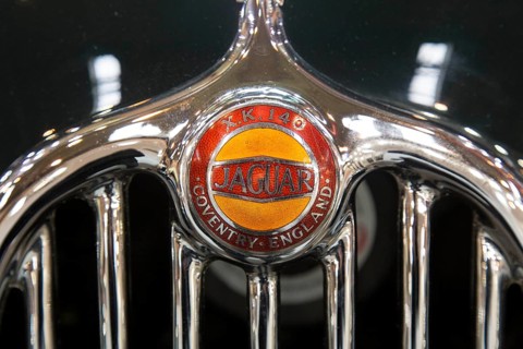 Radiator grille with logo of the Jaguar XK 140. Techno Classica is the trade fair for vintage,