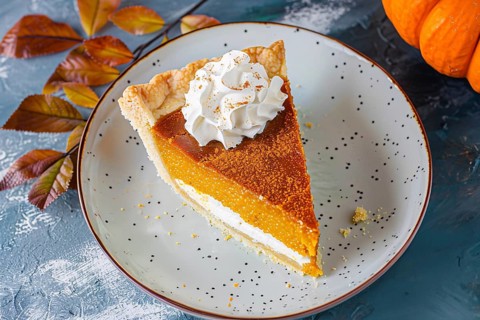 Single slice of pumpkin pie with cream on plate. Generative Ai, AI generated