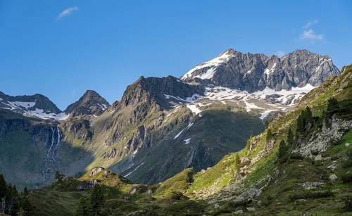 Mountain landscape with waterfall of the mountain stream Zemmbach, behind mountain peak Kleiner