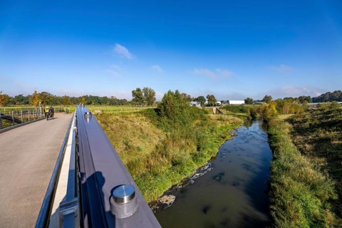 Bridge over the renaturalised Emscher in Emscherland, a new nature and water adventure park at the