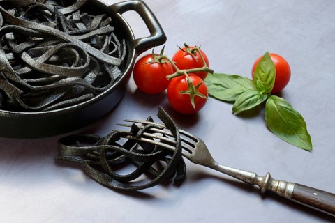 Black pasta coloured with squid ink in shell, Taglioni al Nero di Seppia, Italy, Europe