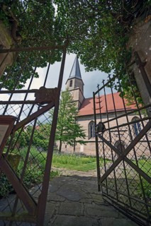 View through the garden gate to the Gothic St Mary's Church, Kalbensteinberg, Middle Franconia,
