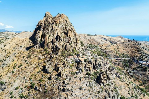 Mountains and Olive groves around Ghost Town from a drone, Pentedattilo Village, Calabria, Italy,