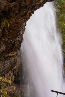 Close-up of a waterfall flowing down next to steep rocks, Lake Brienz, Switzerland, Europe
